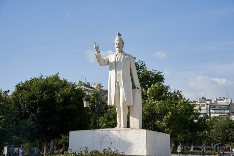 White Statue of Eleftherios Venizelos with a bird on his head.